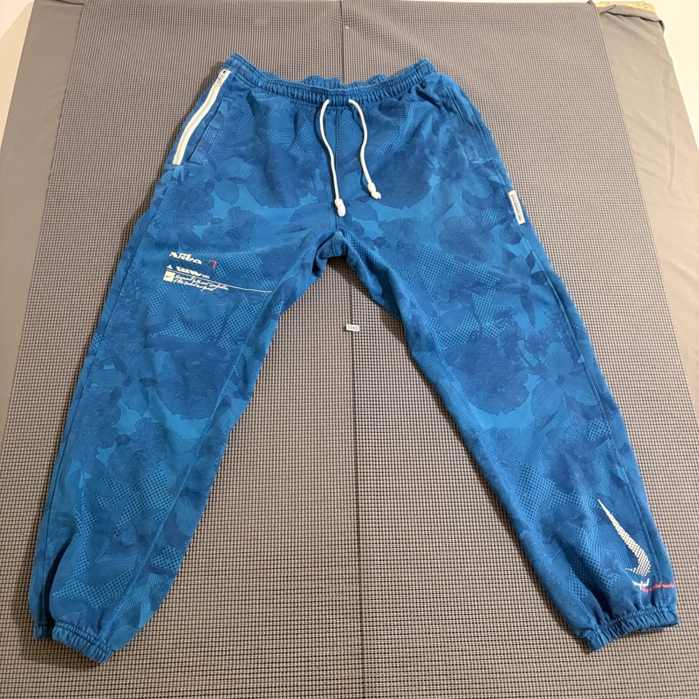 Nike Mens Blue Floral Halftone Grid Joggers Small Estimated